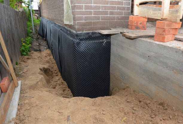 Happy homeowners after waterproofing job in Pettisville
